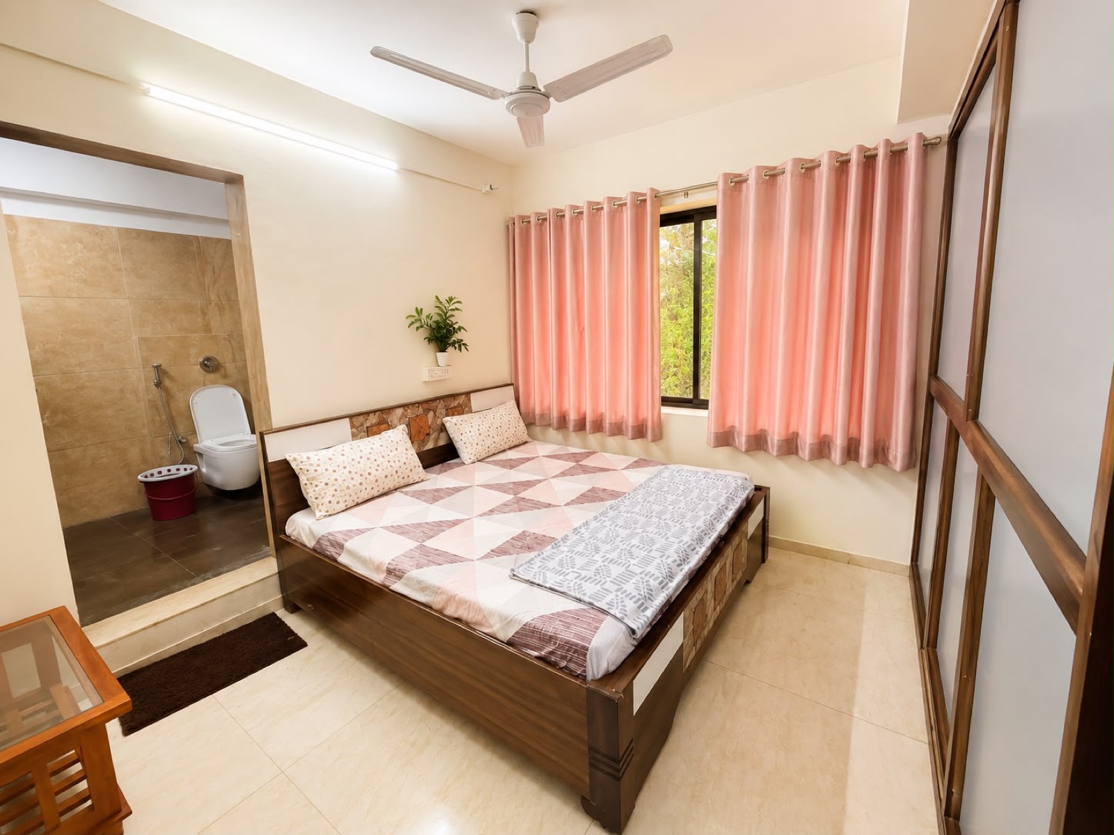Bedroom with double bed and attached bathroom